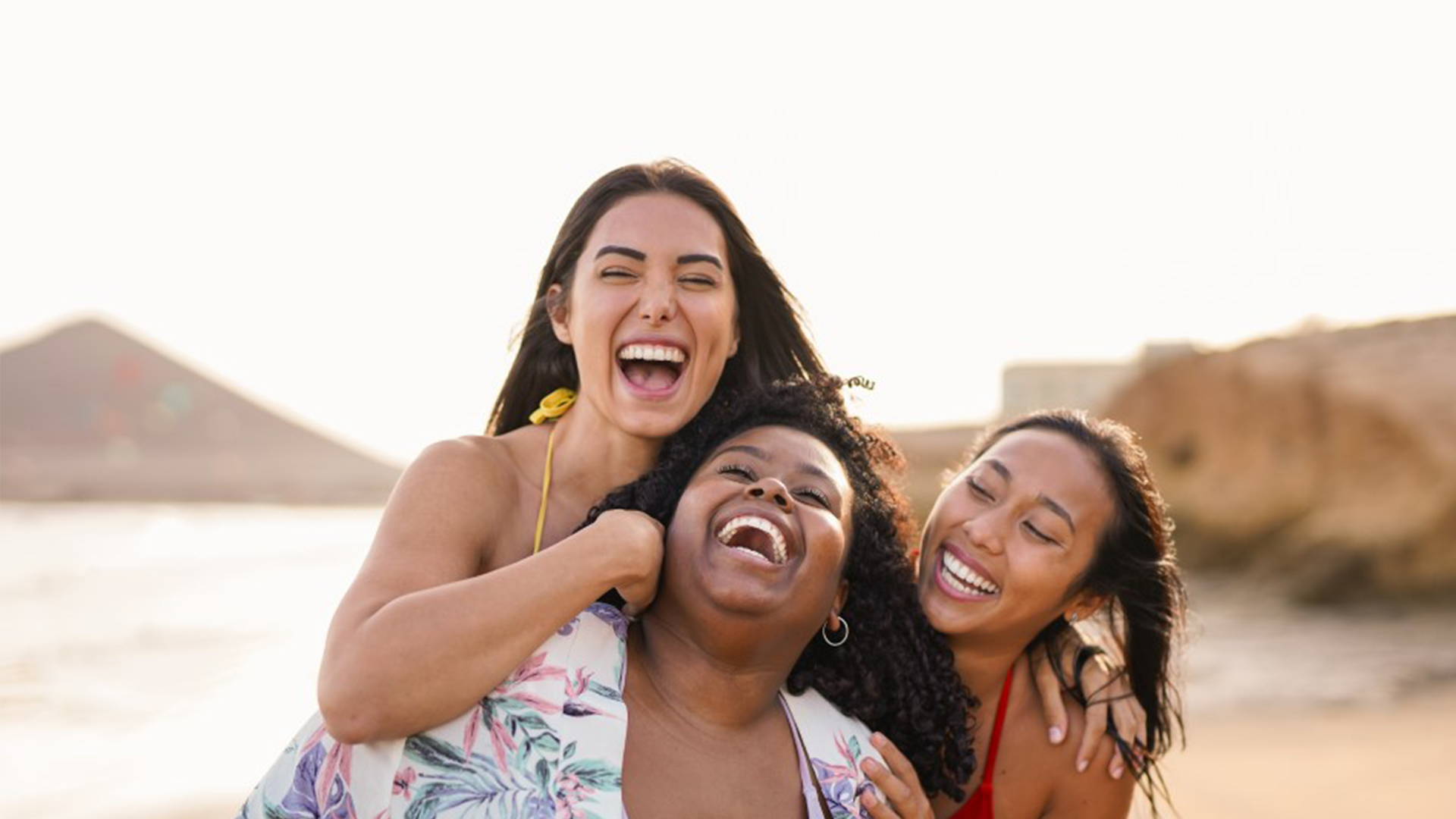 Three people on a beach