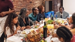 Family gathered around a festive dinner table.