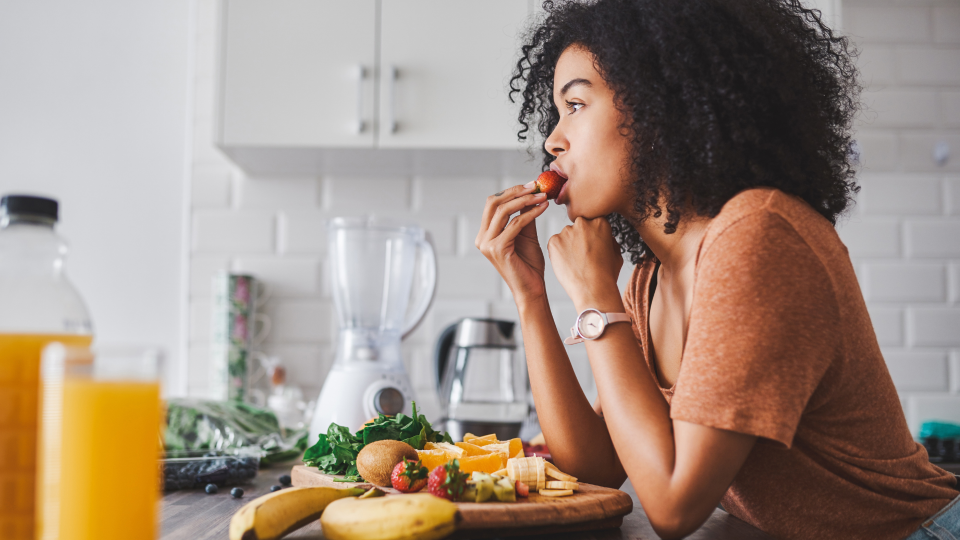 A woman eating fruit