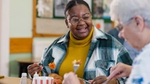 Two people enjoying a meal and smiling at each other.