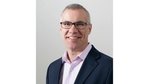 A photo of Steve McCrystal, Unilever Chief Enterprise and Technology Officer. He is a white man, wearing glasses, smiling at the camera