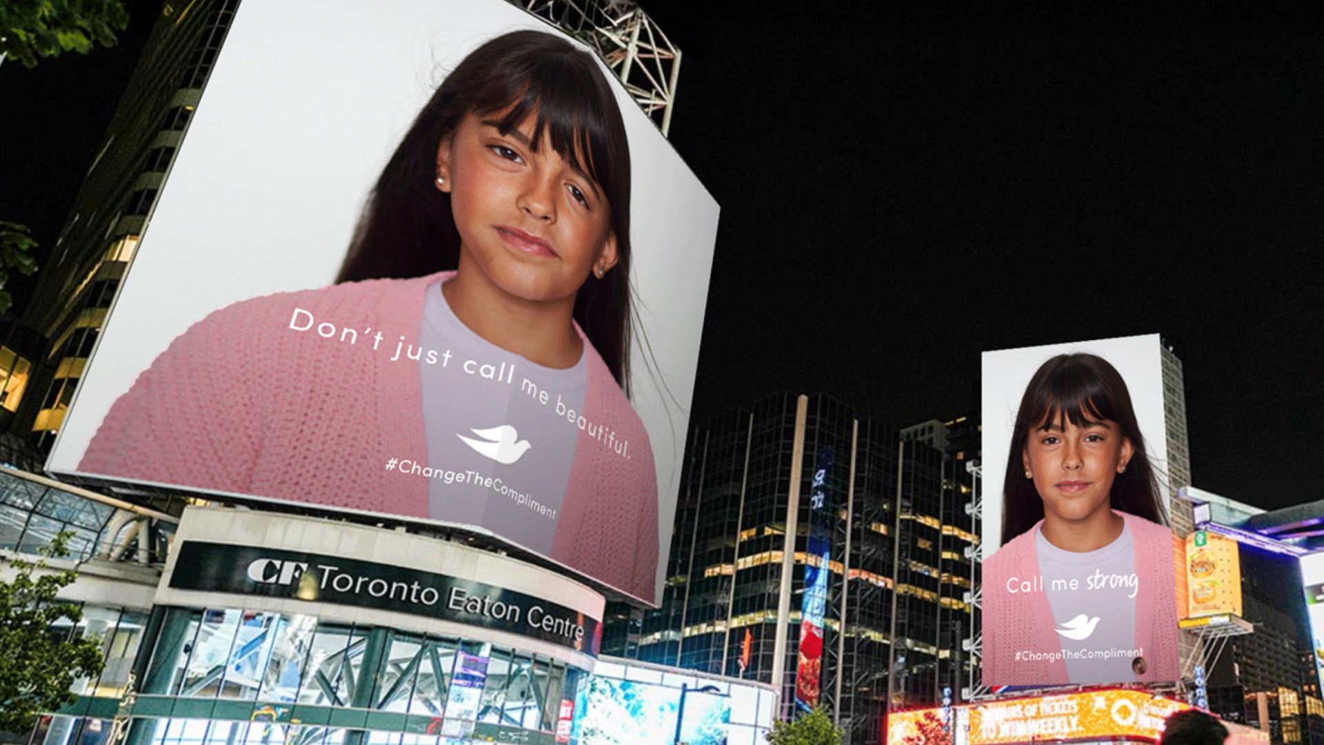 Image of a girl on billboards that state ‘Don’t just call me beautiful’ on one and ‘Call me strong’ on the other.