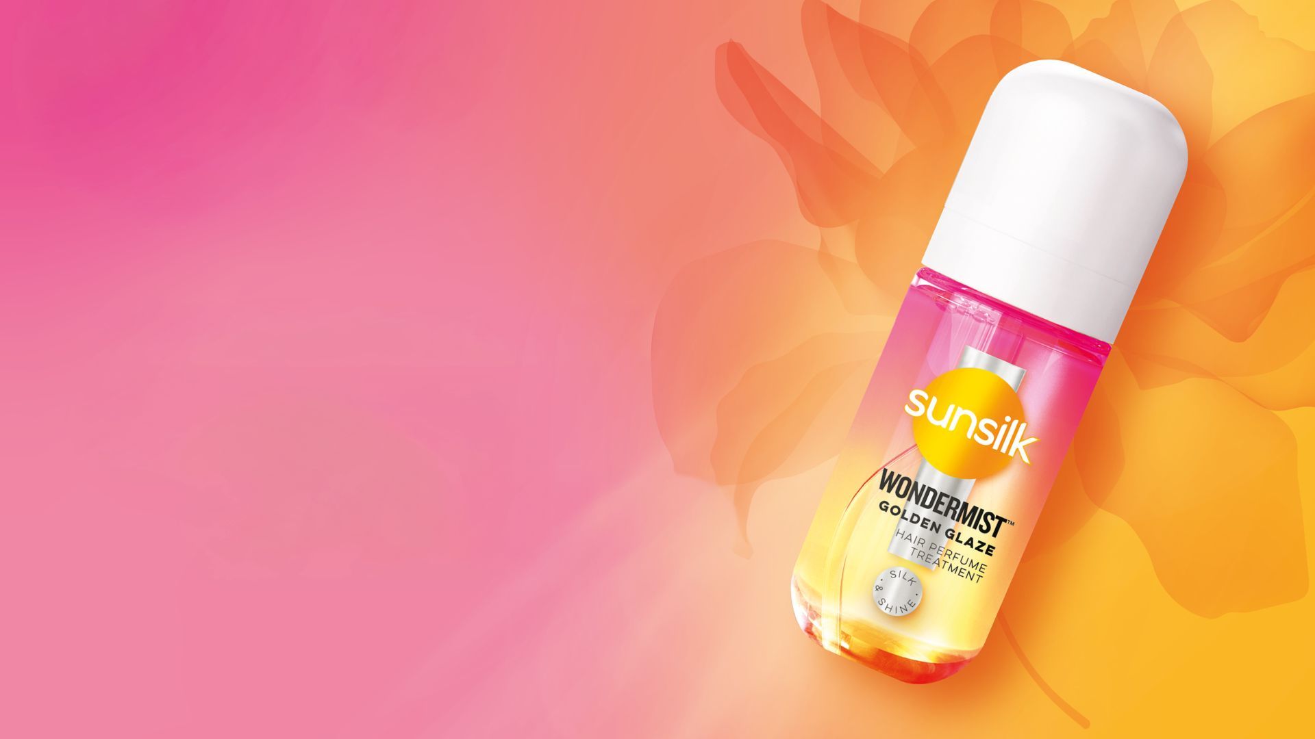 Sunsilk’s new WonderMist hair mist in Golden Glaze. A small pink and orange spray bottle on a pink and orange background.  