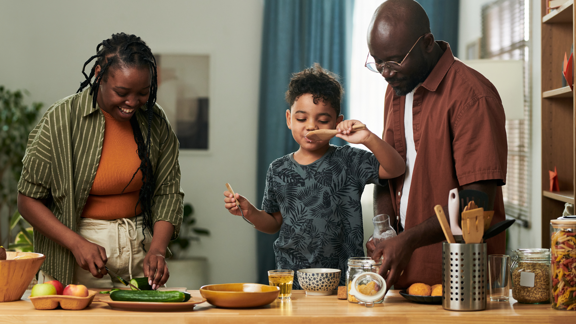 Family cooking together in a kitchen.