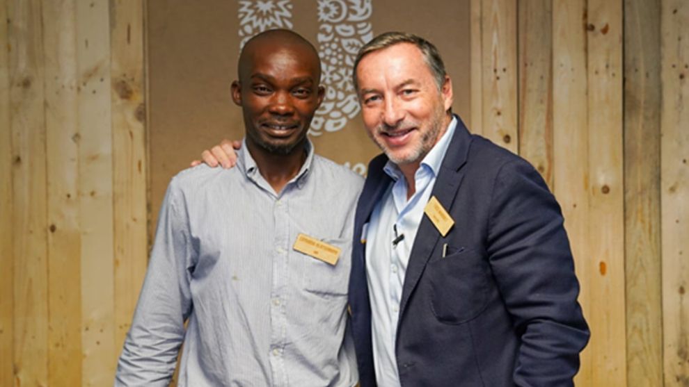 A picture of the Unilever Southern Africa CEO with a man from the African Reclaimers Organisation.